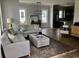 Open concept living room with hardwood floors and kitchen view at 8091 Laurel Ash Ave., Myrtle Beach, SC 29572