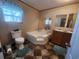 Bathroom with corner tub, double vanity and toilet at 818 Wayne St., North Myrtle Beach, SC 29582