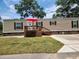 Tan mobile home with deck and red umbrella at 818 Wayne St., North Myrtle Beach, SC 29582