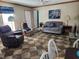 Living room with gray couch, recliner, and dining area at 818 Wayne St., North Myrtle Beach, SC 29582