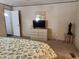 Main bedroom with dresser, TV, and coastal decor at 818 Wayne St., North Myrtle Beach, SC 29582