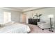 Spacious bedroom with dresser, armchair, and large bed at 834 Ireland Dr., Longs, SC 29568