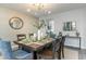 Formal dining room with wooden table and blue upholstered chairs at 834 Ireland Dr., Longs, SC 29568