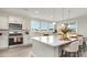 Modern kitchen with white cabinets, large island, and stainless steel appliances at 834 Ireland Dr., Longs, SC 29568