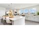 Modern kitchen with white cabinets, large island, and stainless steel appliances at 834 Ireland Dr., Longs, SC 29568