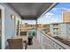 Balcony with table and chairs, overlooking ocean and other buildings at 9520 Shore Dr. # 3B, Myrtle Beach, SC 29572
