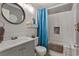 Bathroom with shower/tub combo, gray vanity, and white subway tiles at 9520 Shore Dr. # 3B, Myrtle Beach, SC 29572