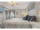 King-size bed, dresser, and TV in a well-lit bedroom with coastal decor at 9520 Shore Dr. # 3B, Myrtle Beach, SC 29572