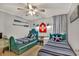 Bedroom with twin beds, beach decor, and ceiling fan at 9520 Shore Dr. # 3B, Myrtle Beach, SC 29572