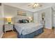 King-size bed, light gray color scheme, and wood floors at 9520 Shore Dr. # 3B, Myrtle Beach, SC 29572