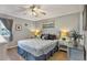 King-size bed, nightstands, and ceiling fan in a bright bedroom at 9520 Shore Dr. # 3B, Myrtle Beach, SC 29572