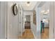 Bright hallway with light wood floors, leading to bedroom and kitchen at 9520 Shore Dr. # 3B, Myrtle Beach, SC 29572