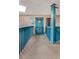 Interior hallway with teal railings and access to unit at 9520 Shore Dr. # 3B, Myrtle Beach, SC 29572