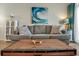 Spacious living room, gray sofa and wooden coffee table at 9520 Shore Dr. # 3B, Myrtle Beach, SC 29572
