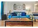 Relaxing living room with teal couch and decorative pillows at 9520 Shore Dr. # 3B, Myrtle Beach, SC 29572