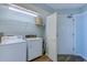 Convenient laundry area with washer, dryer, and shelving at 101 Ocean Creek Dr. # Ee8, Myrtle Beach, SC 29572