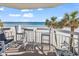 Balcony with seating and ocean view at 1012 N Waccamaw Dr. # 203, Murrells Inlet, SC 29576