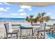 Balcony with seating and ocean view at 1012 N Waccamaw Dr. # 203, Murrells Inlet, SC 29576