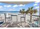 Balcony with seating and ocean view at 1012 N Waccamaw Dr. # 203, Murrells Inlet, SC 29576