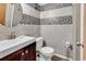 Bathroom showcasing tiled walls, a modern vanity, and sleek fixtures at 1012 N Waccamaw Dr. # 203, Murrells Inlet, SC 29576