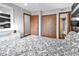 Bright bedroom with large closet, ensuite bathroom, and decorative furnishings at 1012 N Waccamaw Dr. # 203, Murrells Inlet, SC 29576