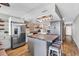 Well-lit kitchen with island, stainless steel appliances, and stylish lighting at 1012 N Waccamaw Dr. # 203, Murrells Inlet, SC 29576