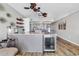 Stylish kitchen with gray cabinets, stainless steel appliances, and a built-in beverage cooler at 1012 N Waccamaw Dr. # 203, Murrells Inlet, SC 29576