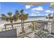 Balcony view showing the pool area and ocean from a well-appointed balcony at 1012 N Waccamaw Dr. # 204, Murrells Inlet, SC 29576