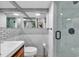 Updated bathroom featuring a modern vanity, subway tile backsplash, and glass enclosed shower at 1012 N Waccamaw Dr. # 204, Murrells Inlet, SC 29576
