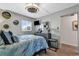 Bedroom featuring stylish ceiling fan, dresser with mirror, and comfortable bed at 1012 N Waccamaw Dr. # 204, Murrells Inlet, SC 29576