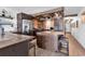 Modern kitchen with stainless steel appliances, wood ceiling, brick backsplash, and bar seating at 1012 N Waccamaw Dr. # 204, Murrells Inlet, SC 29576