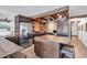 Well-appointed kitchen featuring stainless steel appliances, wood ceiling, and bar seating at 1012 N Waccamaw Dr. # 204, Murrells Inlet, SC 29576