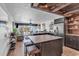 Open-concept living space with hardwood floors, an island bar, and ocean views at 1012 N Waccamaw Dr. # 204, Murrells Inlet, SC 29576