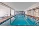 Indoor pool with a jacuzzi, lounge area, and well lit interior at 1012 N Waccamaw Dr. # 204, Murrells Inlet, SC 29576