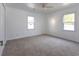 Bedroom with plush carpet, bright lighting from the dual windows and neutral color palette at 104 Willow Ridge Rd., Myrtle Beach, SC 29588