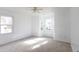 Sunlit bedroom features plush neutral carpet and large windows for natural light at 104 Willow Ridge Rd., Myrtle Beach, SC 29588