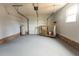 Spacious two-car garage with painted floor and brick accents, offering ample storage and utility space at 104 Willow Ridge Rd., Myrtle Beach, SC 29588