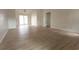 Large open living area with light wood flooring and access to outdoor spaces, perfect for entertaining at 104 Willow Ridge Rd., Myrtle Beach, SC 29588