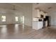Bright open-concept living space flows into a modern kitchen with white cabinets and stainless steel appliances at 104 Willow Ridge Rd., Myrtle Beach, SC 29588