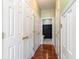 Light-filled hallway with multiple closets and wood-look flooring at 107 Maddux Ln. # E, Myrtle Beach, SC 29588