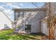 Tan vinyl-sided home with patio and landscaping at 107 Maddux Ln. # E, Myrtle Beach, SC 29588