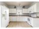 Kitchen with white cabinets and appliances at 107 Maddux Ln. # E, Myrtle Beach, SC 29588
