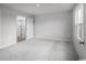 Spacious main bedroom with ample natural light, carpeted floors, and an attached bathroom at 1080 Oak Meadow Dr., Conway, SC 29526