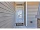 Front door with welcome mat and glass panel at 1240 Pineridge St., Conway, SC 29527