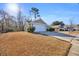 A neatly kept residence, enhanced by well-maintained greenery and a paved driveway at 1240 Pineridge St., Conway, SC 29527