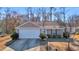 A well-maintained one-story home with a two-car garage and manicured landscaping at 1240 Pineridge St., Conway, SC 29527