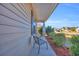 Cozy front porch features a seating area perfect for relaxing and enjoying the neighborhood views at 1240 Pineridge St., Conway, SC 29527