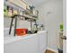 Efficient laundry room with built-in shelving to maximize storage space at 1240 Pineridge St., Conway, SC 29527