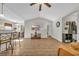 Bright living room with hardwood floors, ceiling fan and open floorplan to dining at 1240 Pineridge St., Conway, SC 29527