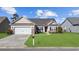 Single-story house with a brick facade and a two-car garage at 129 Yeomans Dr., Conway, SC 29526